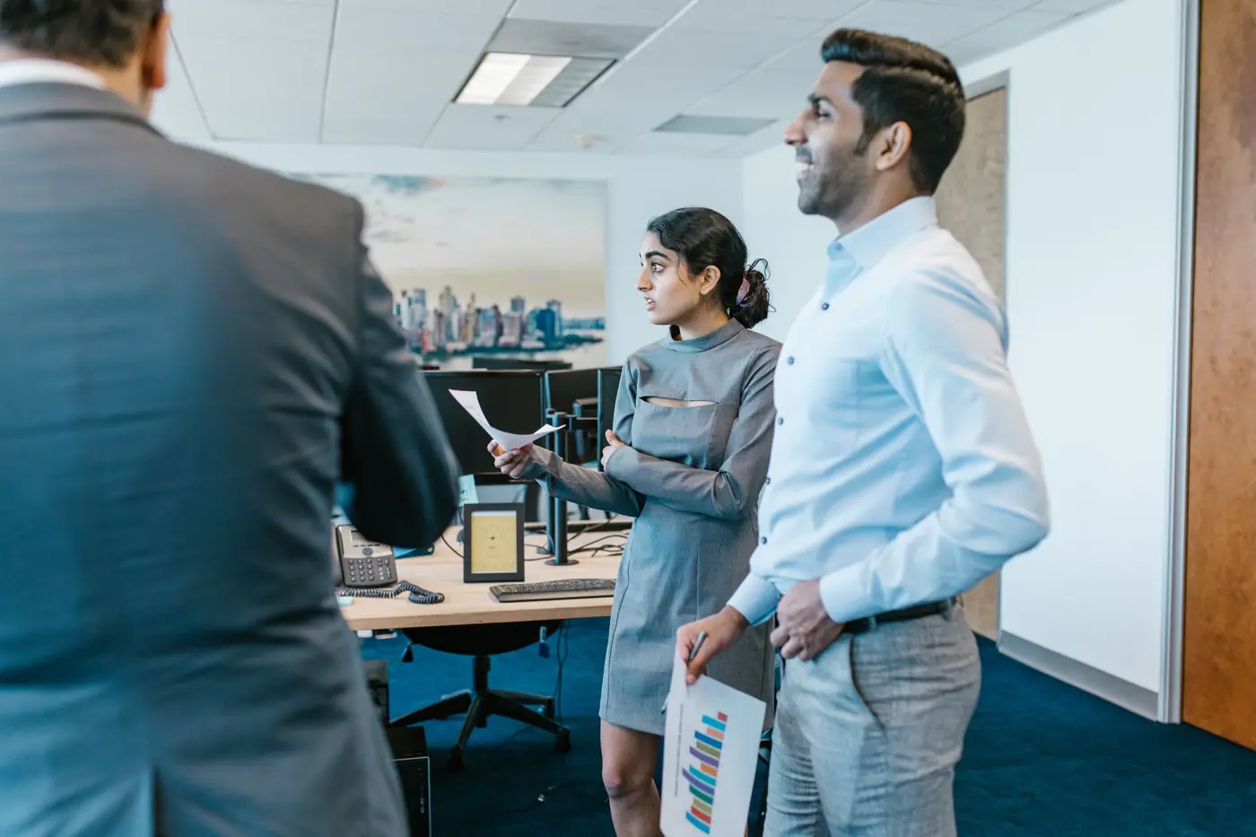 Three business professionals comparing options